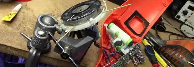 Vacuum cleaner repair parts and tools on a workbench in Fresno, CA